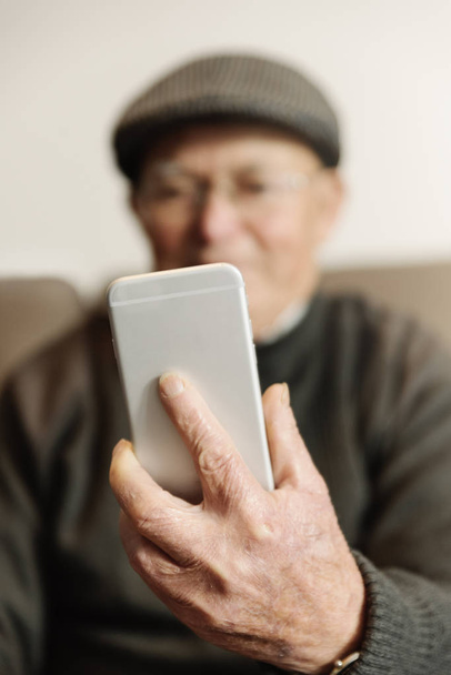 Senior man using his mobile phone. - Photo, Image