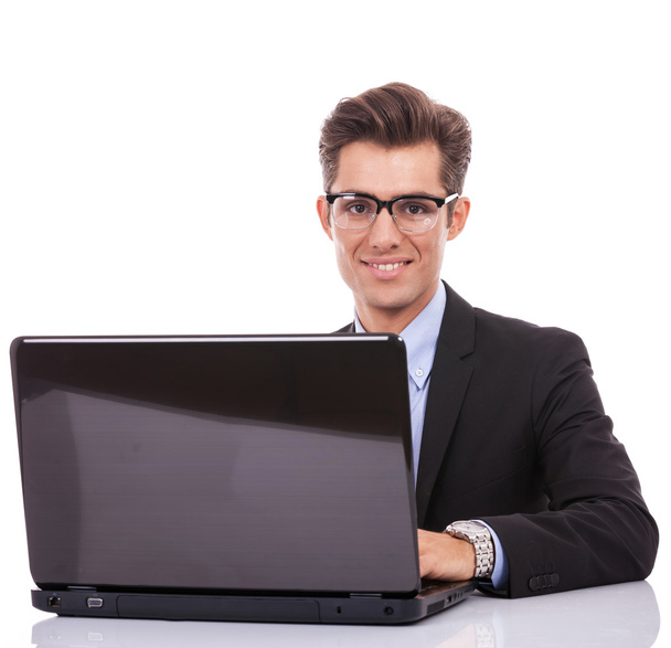 Business man at his desk with a laptop - Fotó, kép