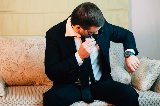 businessman looking at his wristwatch - 写真・画像