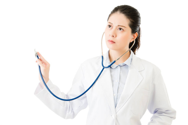 successful asian woman doctor use stethoscope to auscultation - 写真・画像
