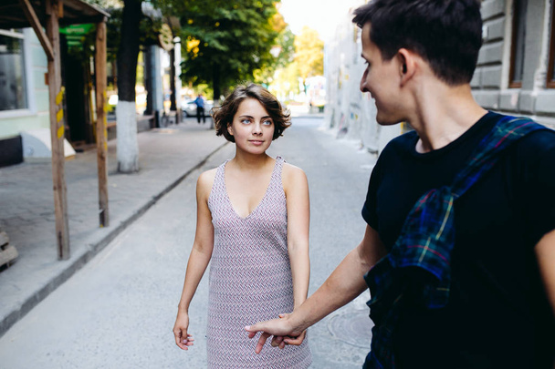 couple walking on the street holding hands - Zdjęcie, obraz