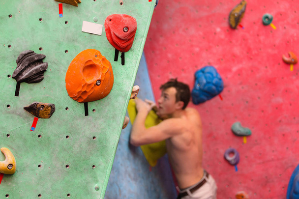 Handsome muscular naked shirtless climber at gym wall - Photo, Image