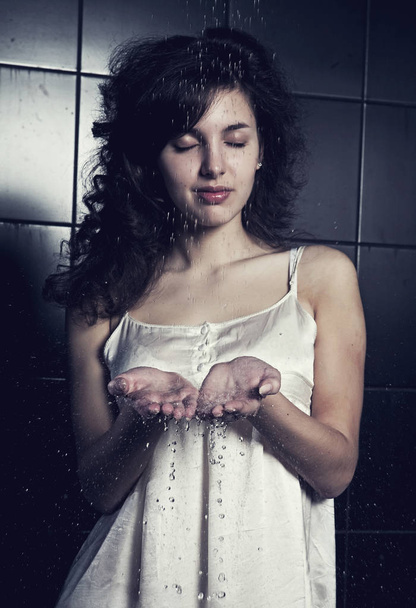 young curly woman with water - Fotografie, Obrázek