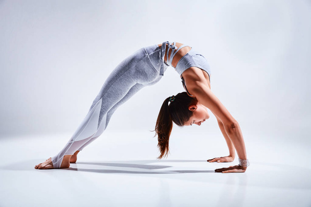Woman doing yoga isolated on white background - Zdjęcie, obraz