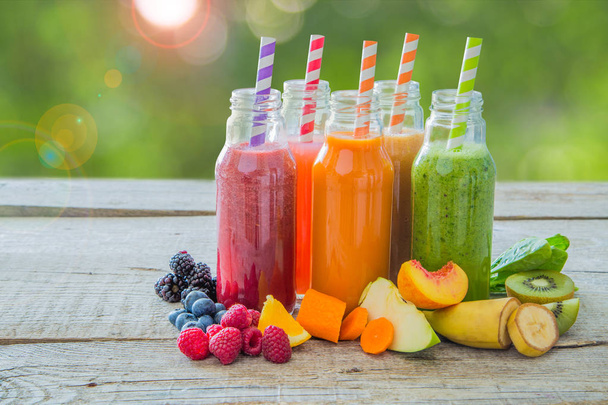 Selection of colourful smoothies on rustic wood background - Фото, изображение