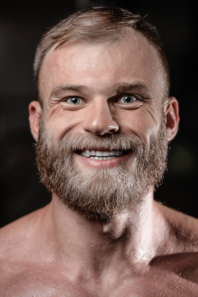 brutal muscular man with beard unshaven fitness model healthcare - Фото, зображення