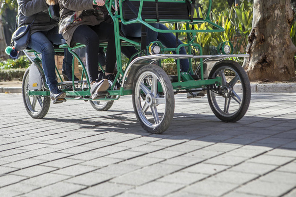 Surrey bike in motion at Plaza de Espana, Seville - Photo, Image