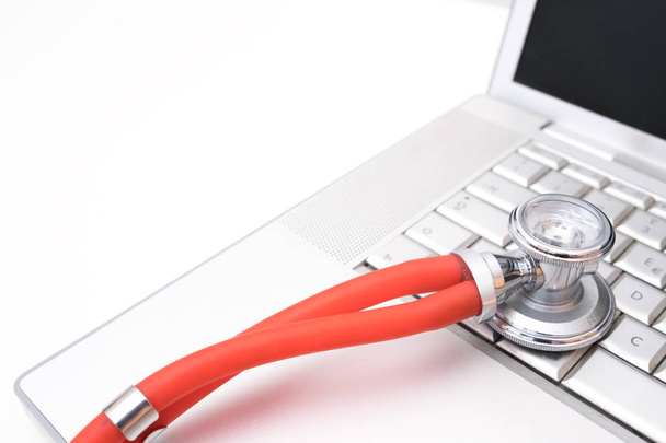Medical stethoscope on a laptop - Фото, зображення
