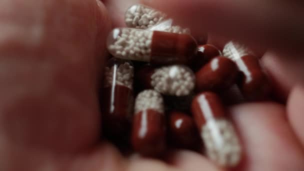 Pills in hand, close up shot. - Filmati, video