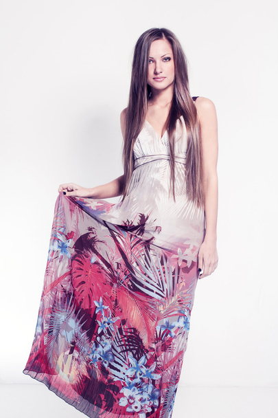 Beautiful young woman in long trendy dress, fashion model - Foto, afbeelding