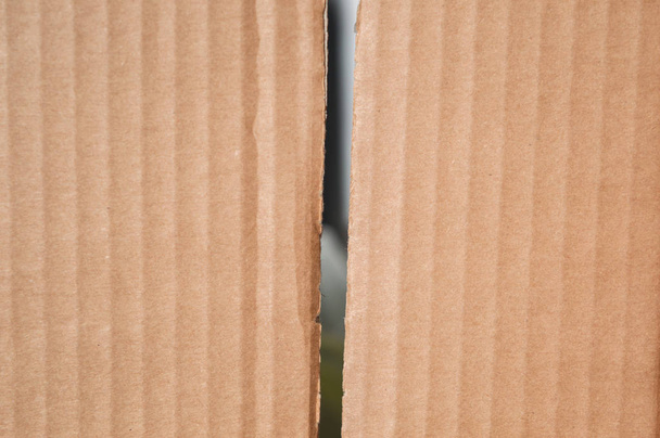 Texture of  two clean brown cardboard box pieces. Wavy folded pa - Photo, Image