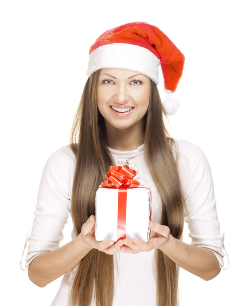 Beautiful young girl with christmas gift - 写真・画像