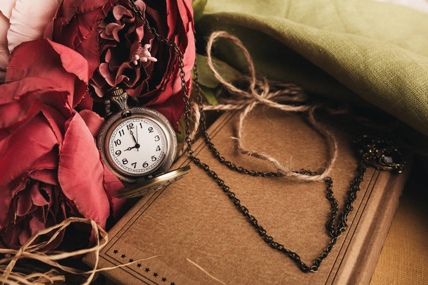 Craft paper note with cup of tea, flowers, peonies, old vintage clock. Retro background. - Fotografie, Obrázek