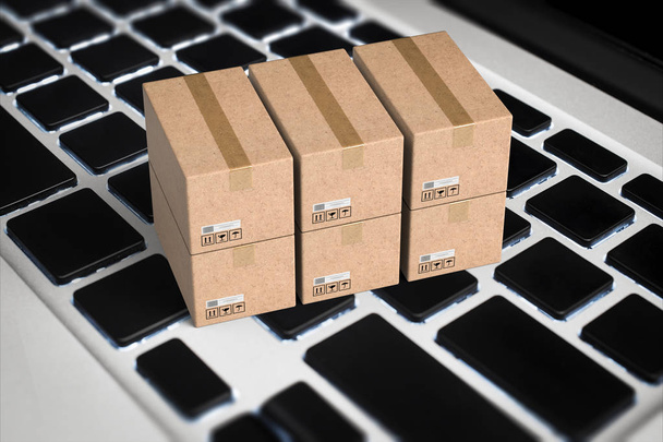 Online businessconcept met kartonnen doos op toetsenbord - Foto, afbeelding
