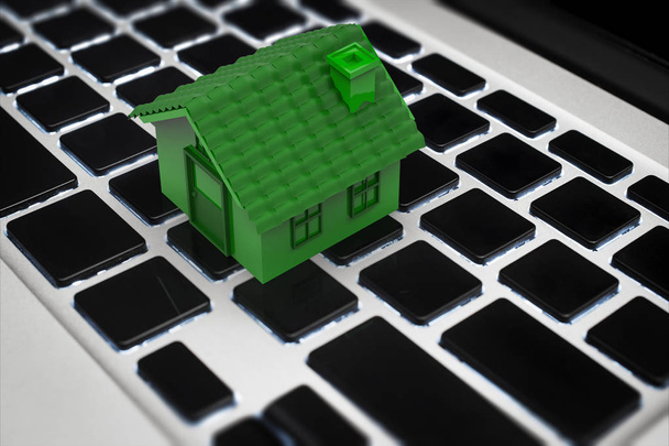 online επιχειρηματική ιδέα με πράσινο σπίτι στο πληκτρολόγιο - Φωτογραφία, εικόνα