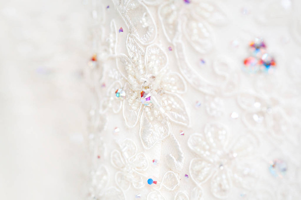 Bride's dress with embroidered elements and beads. Bride's traditional symbolic accessory. - 写真・画像