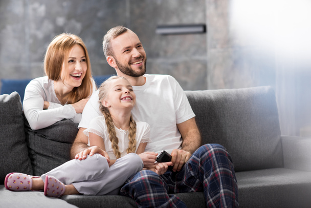 Happy family watching tv - Photo, Image