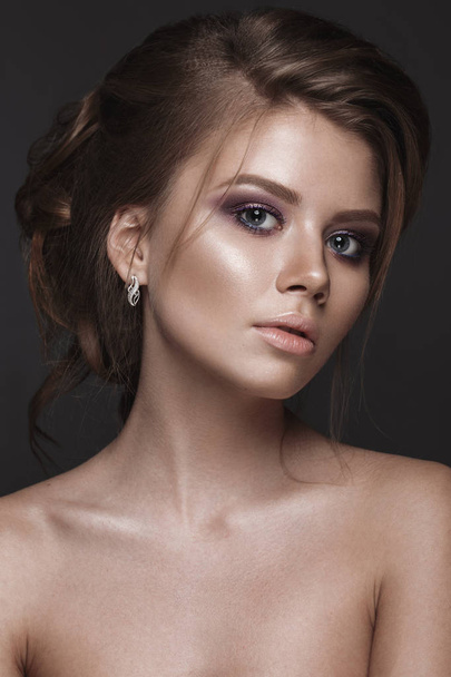 Beautiful girl with perfect skin, evening make-up, wedding hairstyle. Beauty face. - Fotó, kép