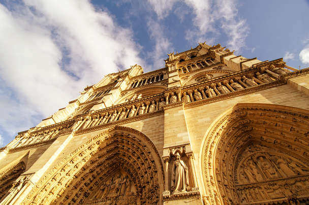 Upward street view of Notre Dame Cathedral in Paris - Photo, Image