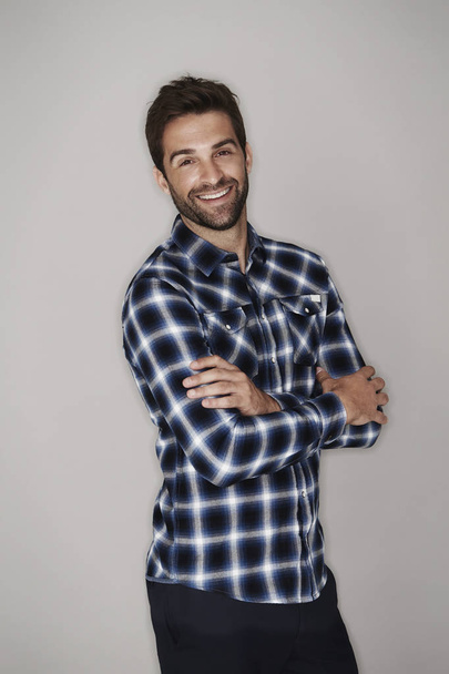 Smiling man in checkered shirt  - Foto, Imagem