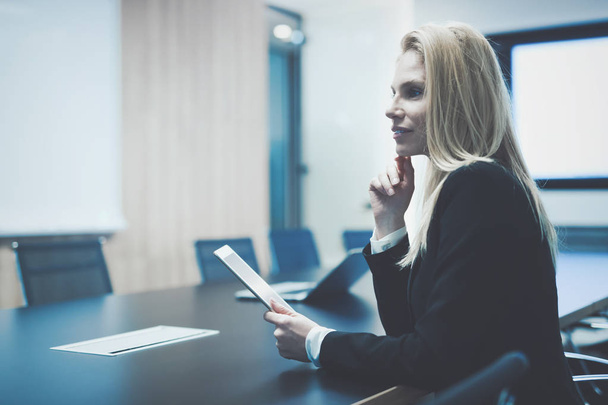 Businesswoman using tablet in conference room - Photo, image