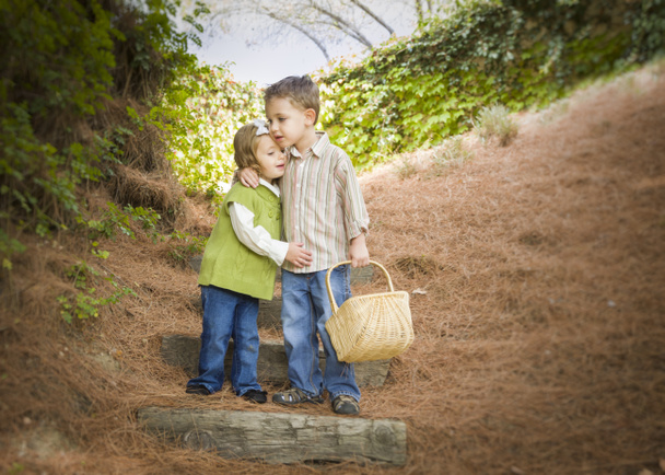 Two Children with Basket Hugging Outside on Steps - Photo, Image