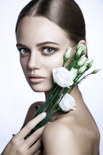 Calm Beauty Fashion Model Woman face. Portrait with white Rose flower.  - Fotó, kép