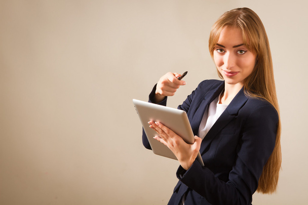 Beautiful woman working on a Person Using Modern Tablet Device. - 写真・画像