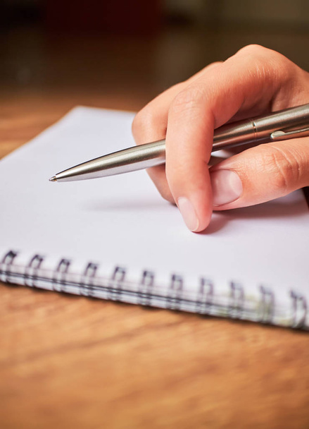 write with a pen in a notebook  - Фото, зображення