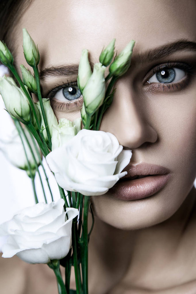 Calm Beauty Fashion Model Woman face. Portrait with white Rose flower.  - Фото, изображение