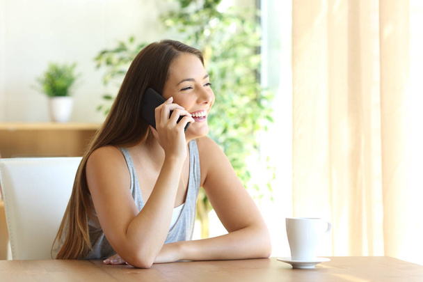 Funny girl taking a phone conversation - Фото, изображение