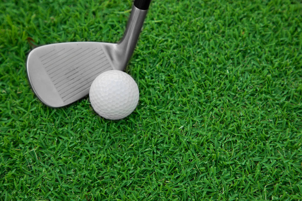 iron golf club and ball on a green grass - Photo, Image