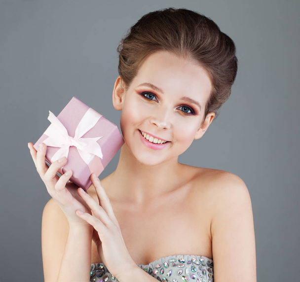Laughing Woman Fashion Model with Makeup and Hairstyle Holding a - Photo, Image