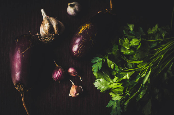 Fresh eggplants and vegetables  - Фото, изображение