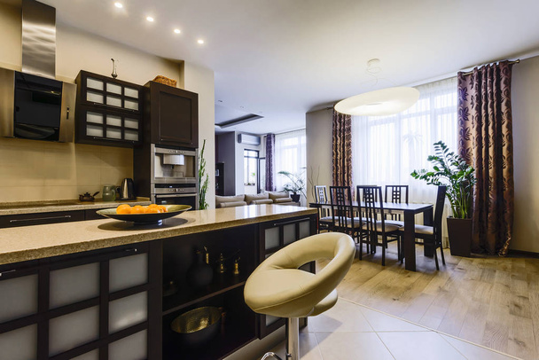 Elegant kitchen with dining area in a modern style  - Fotó, kép