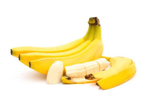 バナナとバナナのスライスと白い背景の皮膚 - 写真・画像