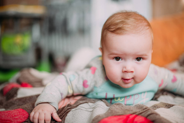 little cute baby toddler on carpet close up smiling adorable happy emotional playing at home - Photo, Image