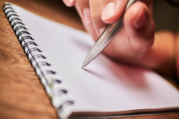 write with a pen in a notebook  - Φωτογραφία, εικόνα