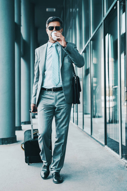  Business travel, businessman walking with suitcase - 写真・画像
