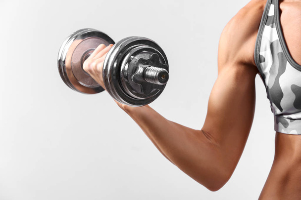 Sporty woman with dumbbell - Foto, Imagem