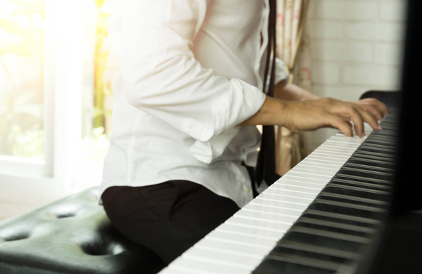 Selected focus on piano keys man playing the piano - Фото, зображення