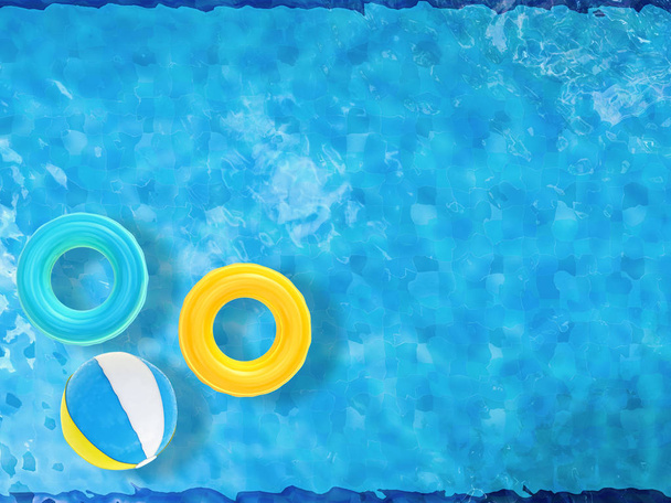 beach balls and swim rings floating on pool  - Photo, Image