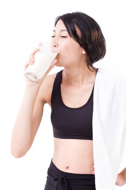 beautiful sport woman drinking milk - Photo, Image