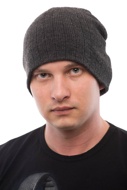 fashionable young man in a gray cap on a white background - Foto, afbeelding