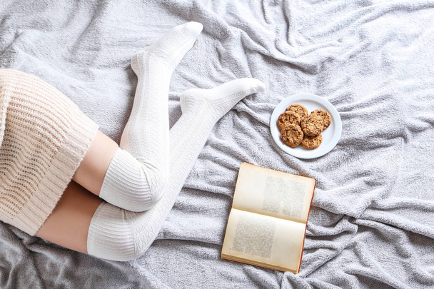 Woman with cookies and book - 写真・画像