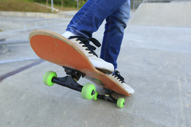 skateboarder legs practicing outdoors - Fotó, kép