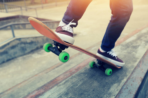 skateboarder legs practicing outdoors - Fotó, kép