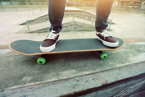 skateboarder legs practicing outdoors - Фото, зображення