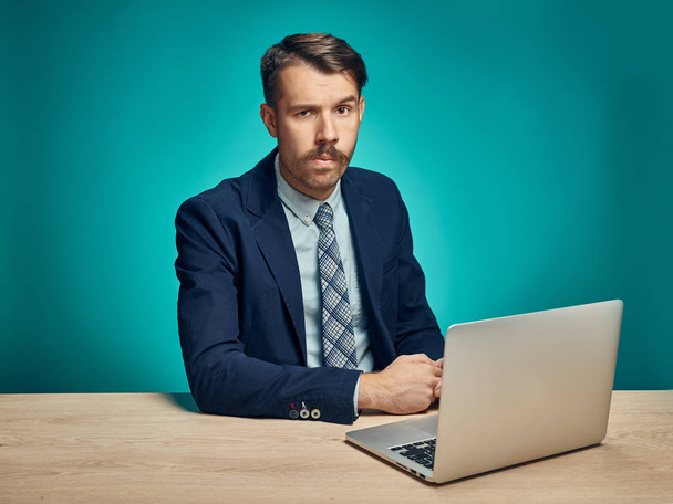 Sad Young Man Working On Laptop At Desk - Zdjęcie, obraz