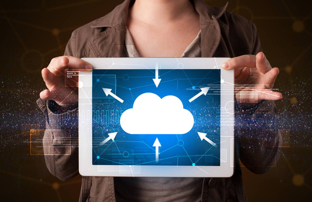 Woman holding tablet with cloud icon - Foto, imagen